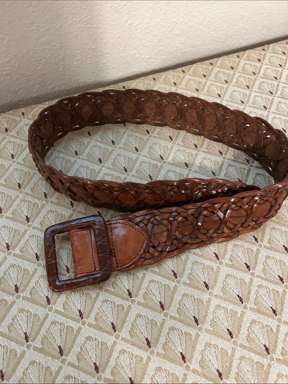 Harold’s brown woven leather belt